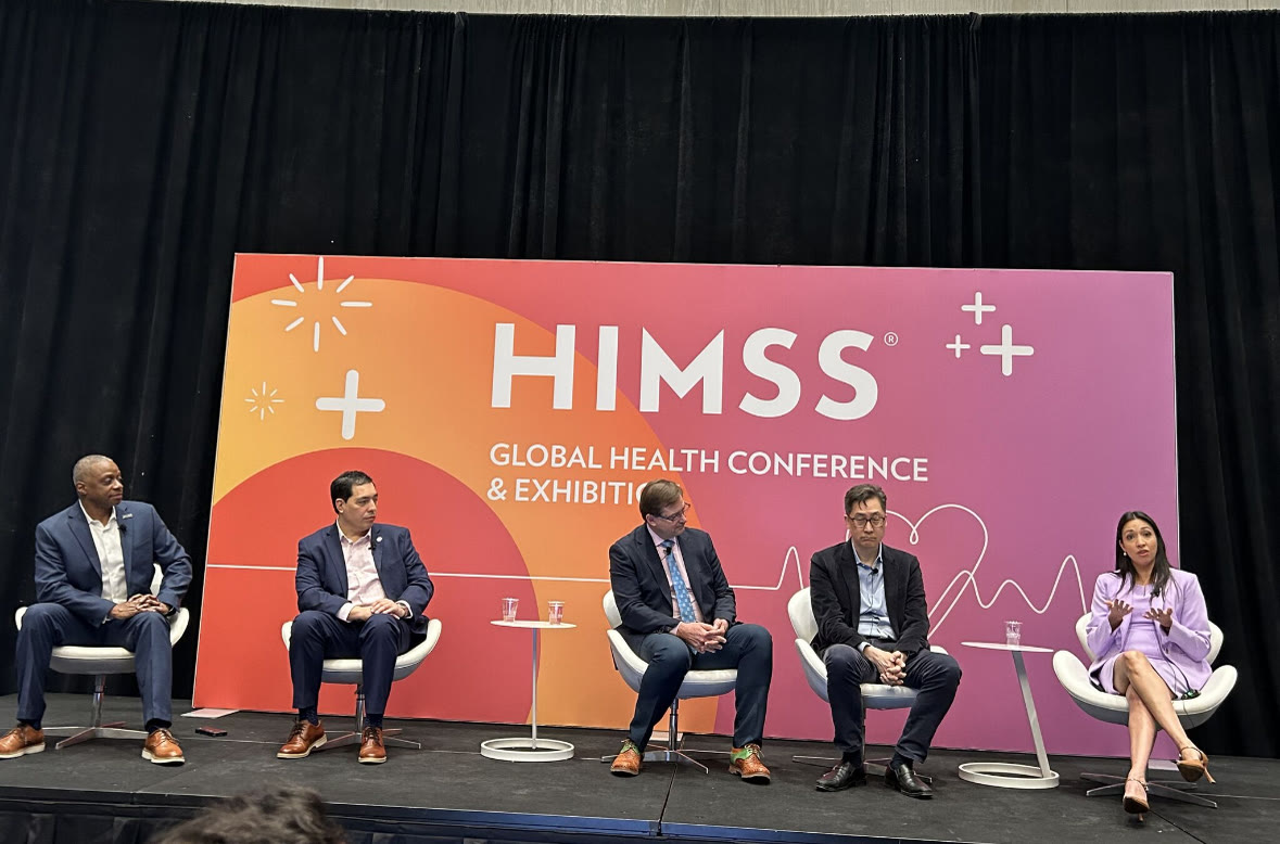 Dr. Gigi Magan, healthcare AI speaker, presenting her research at a conference