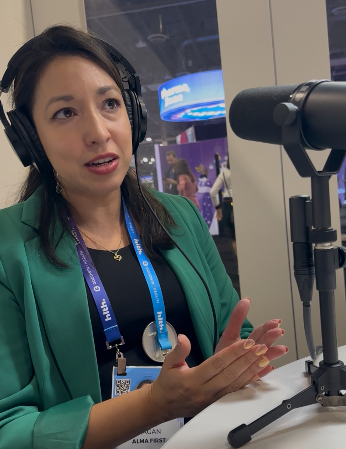 Dr. Gigi Magan recording a podcast